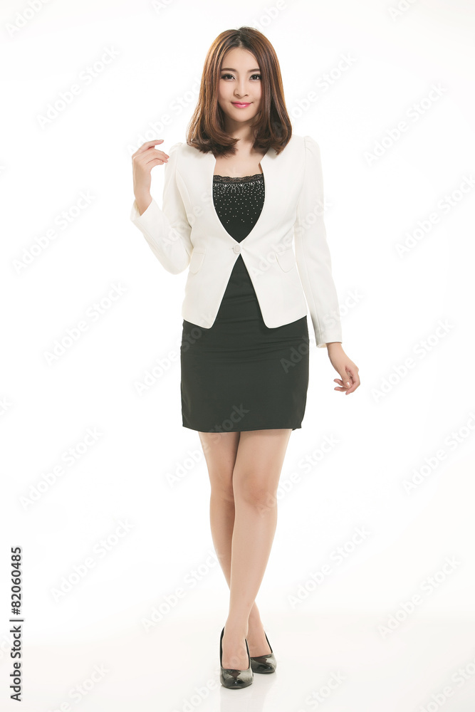 Fototapeta premium Young Asian women wearing a suit in front of a white background