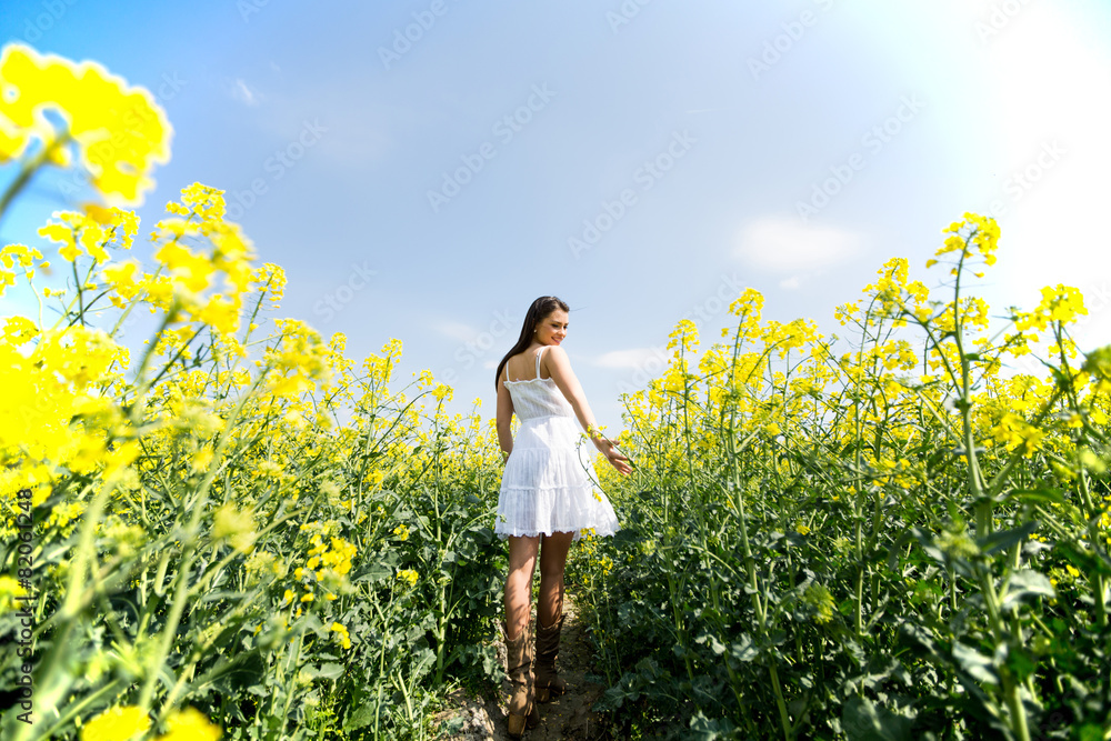 Young woman in the spring field Young woman in the spring field