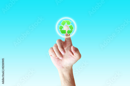 hand pushing a button recycle on a touch screen interface
