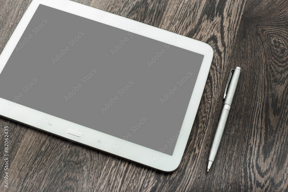 digital tablet on wooden table