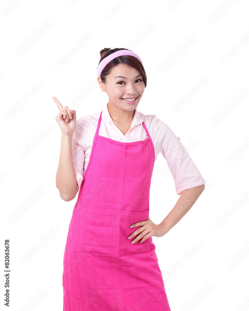 Happy young woman housewife showing Happy young woman housewife showing