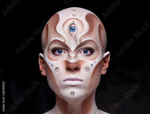 Portrait of a mysterious woman with fantastic makeup Alien