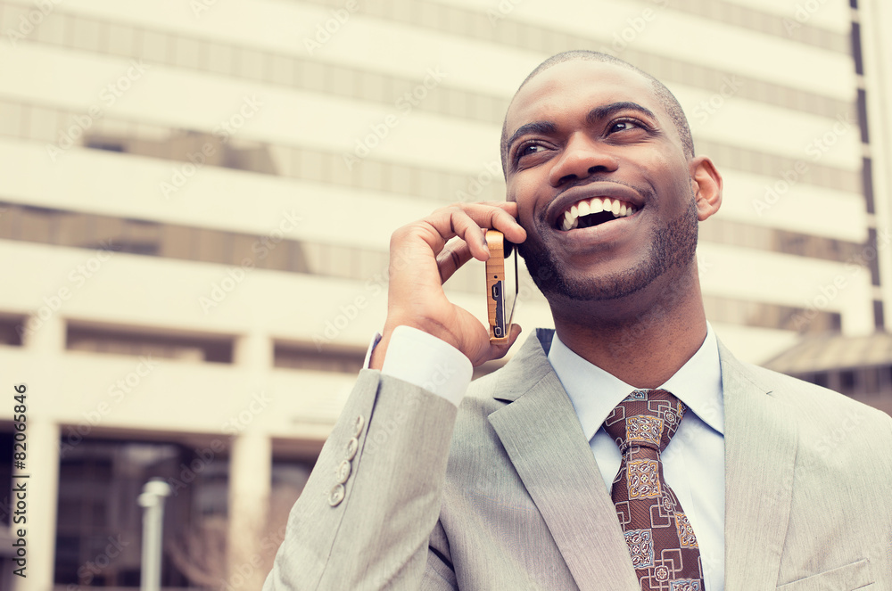 handsome happy laughing businessman talking on mobile phone handsome happy laughing businessman talking on mobile phone