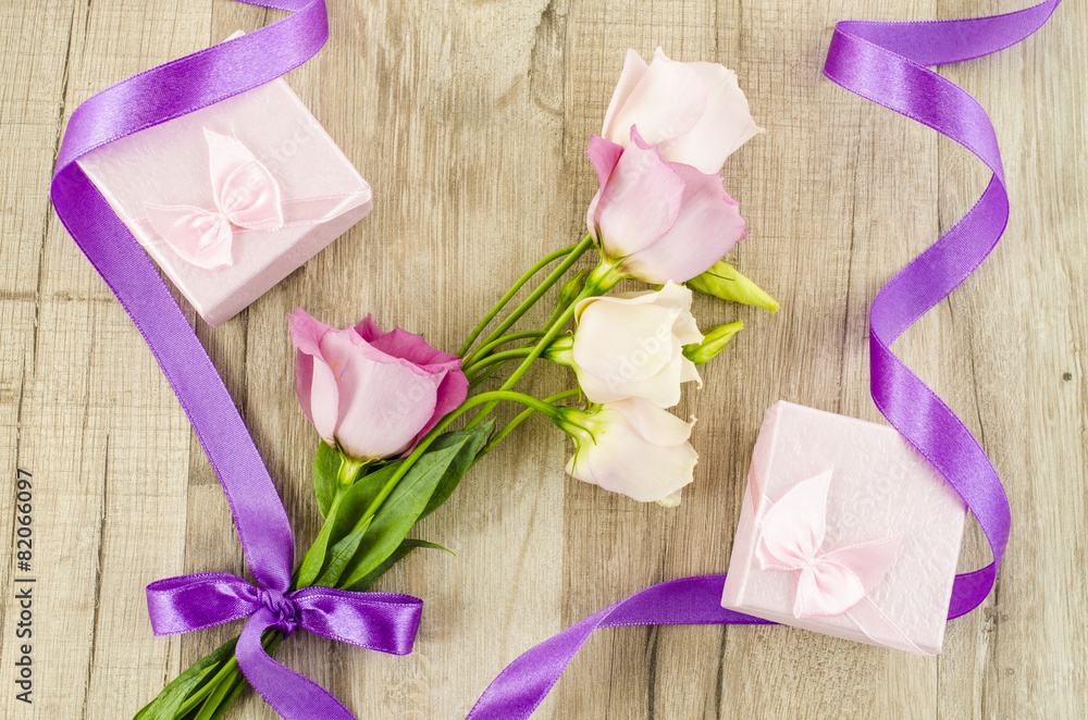 Pink flower and gift box on wooden background Pink flower and gift box on wooden background