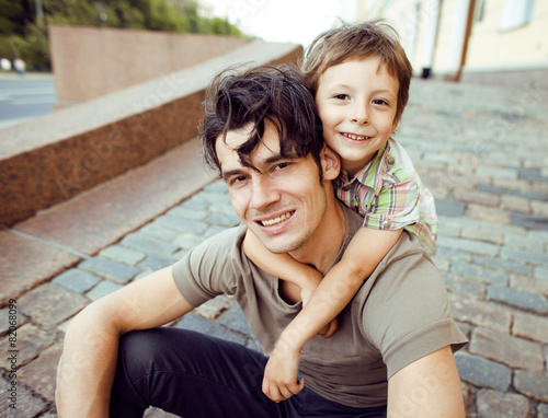 little son with father in city photo