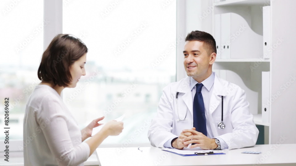 smiling doctor and young woman meeting at hospital smiling doctor and young woman meeting at hospital