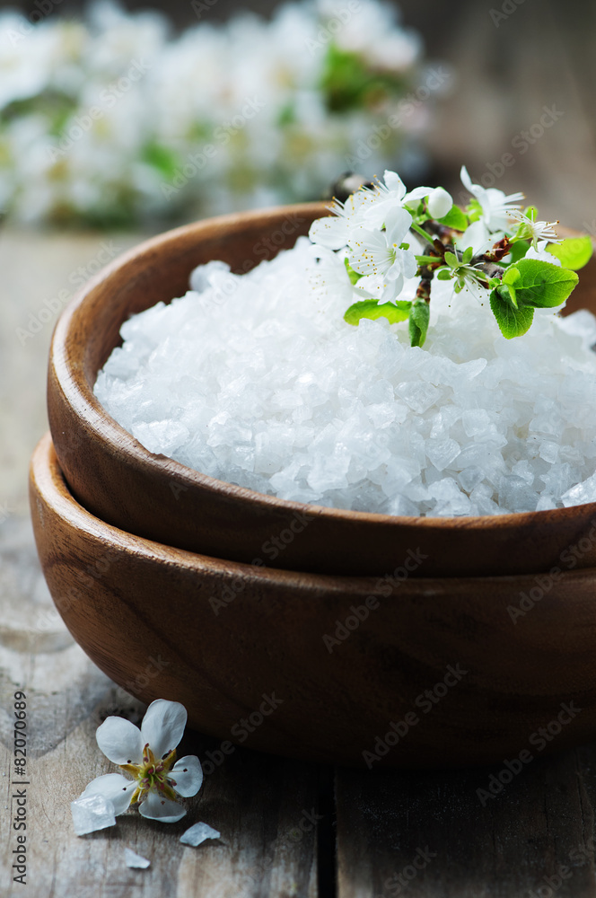 White salt and flowers for spa treatment White salt and flowers for spa treatment