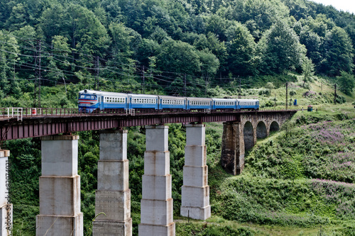 Train on the railway bridge in Carpathian mountains, Ukraine