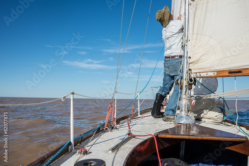 Senior retired sailing Buenos Aires River to Uruguay. Sport free