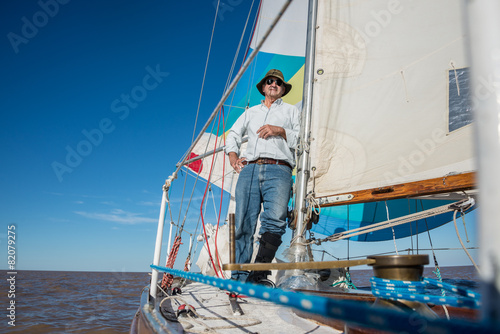 Senior retired sailing Buenos Aires River to Uruguay. Sport free