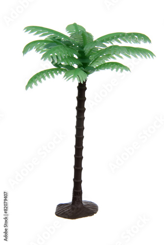 Plastic palm tree toy isolated on white background