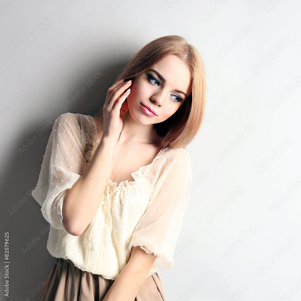 Portrait of young model on gray background Portrait of young model on gray background