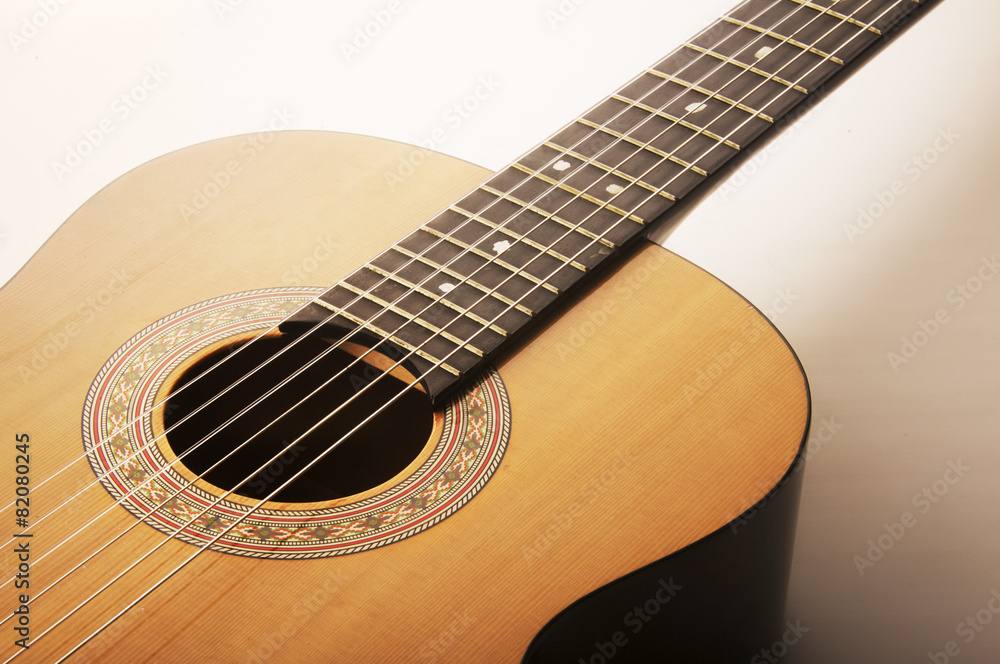Studio detail photograph of an acoustic spanish classical guitar Studio detail photograph of an acoustic spanish classical guitar