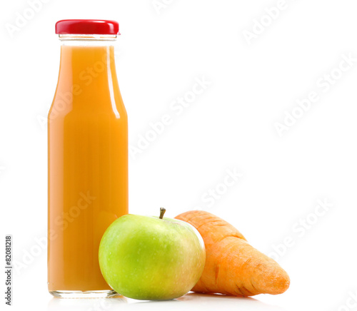 Glass bottle of fresh healthy juice with carrot and apple