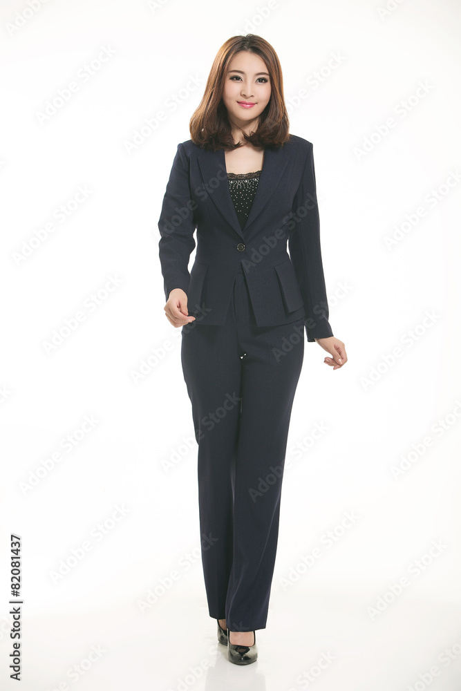 Young Asian women wearing a suit in front of a white background Young Asian women wearing a suit in front of a white background