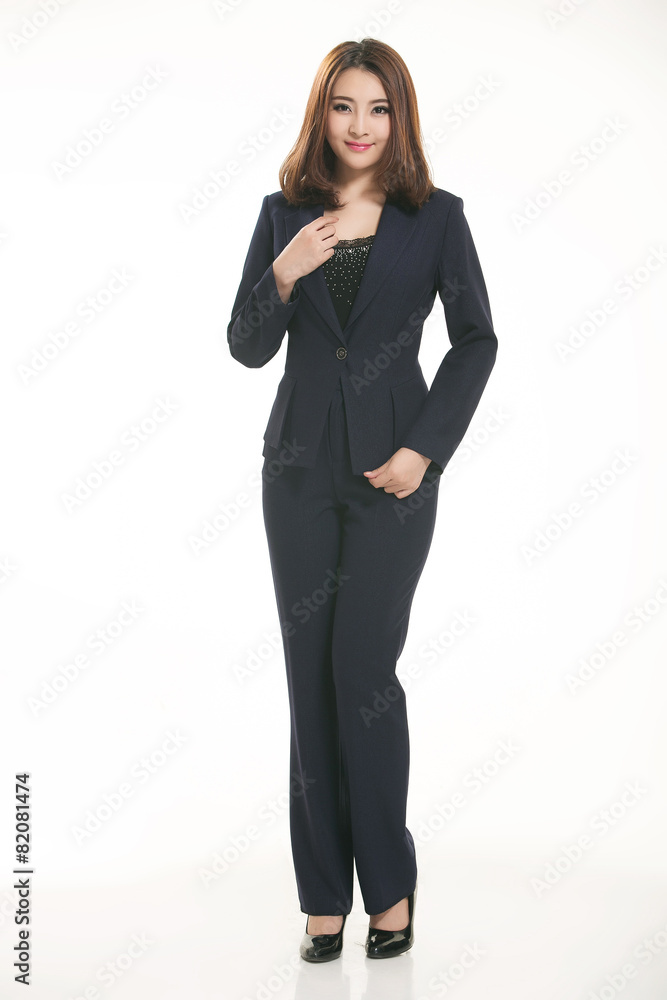 Young Asian women wearing a suit in front of a white background Young Asian women wearing a suit in front of a white background