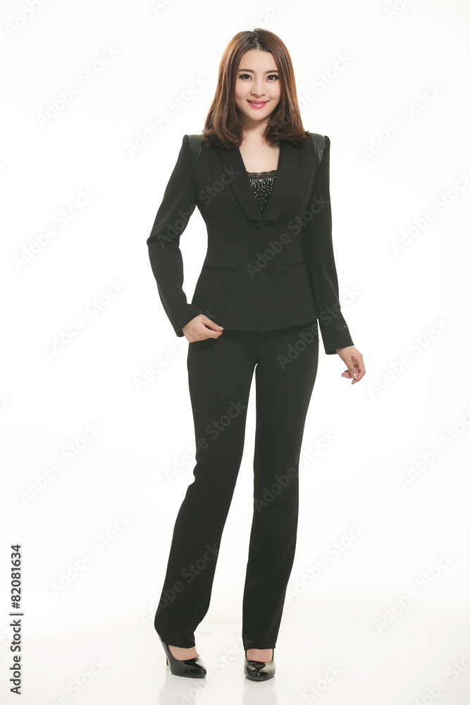 Young Asian women wearing a suit in front of a white background Young Asian women wearing a suit in front of a white background
