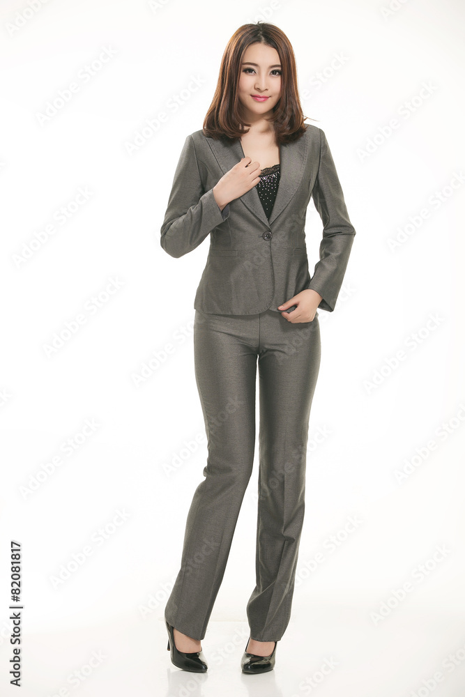 Young Asian women wearing a suit in front of a white background Young Asian women wearing a suit in front of a white background