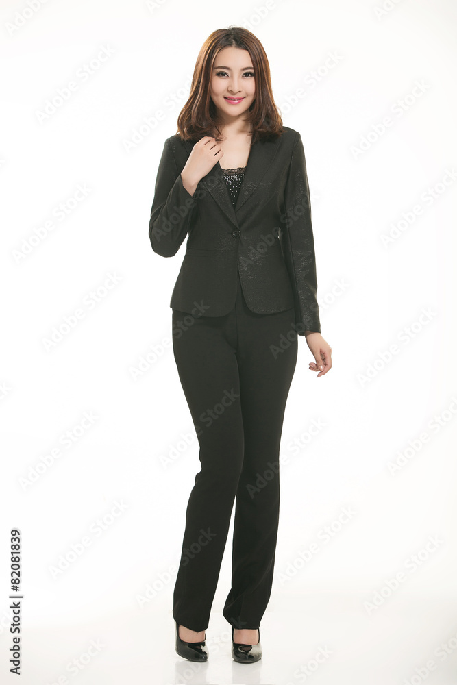 Young Asian women wearing a suit in front of a white background Young Asian women wearing a suit in front of a white background
