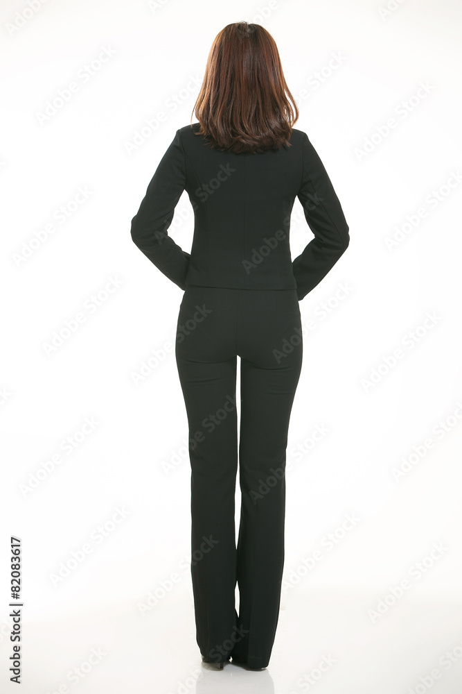 Fototapeta premium Young Asian women wearing a suit in front of a white background