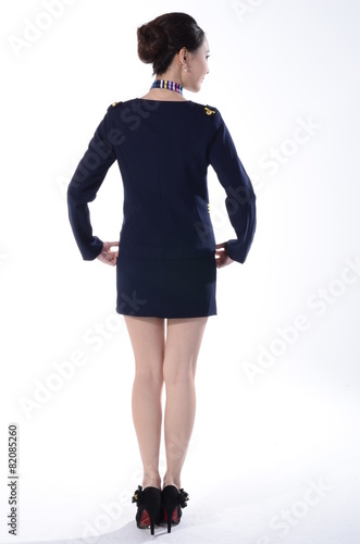 Active girl wear professional attire in front of a white backgro