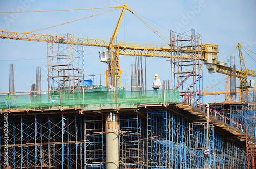 Builder worker with Machinery Building Construction Site