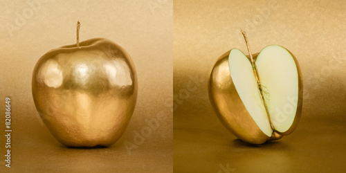 Whole and opened apple with golden peel on gold background