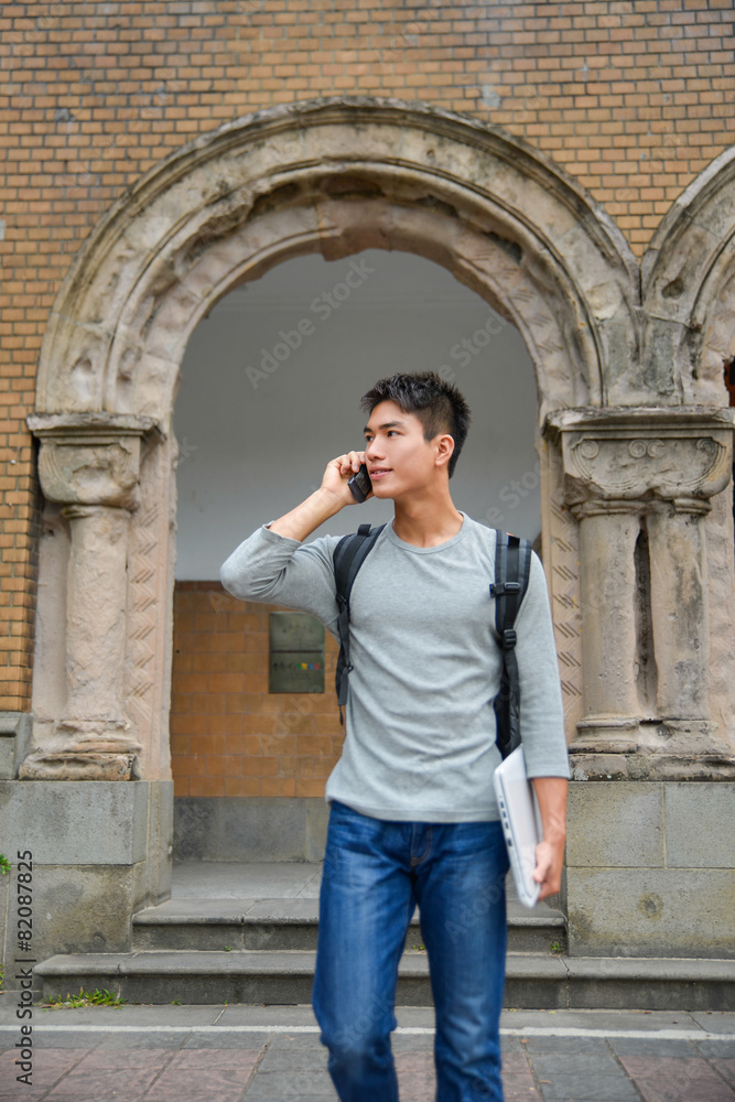 Asian college student standing at college

