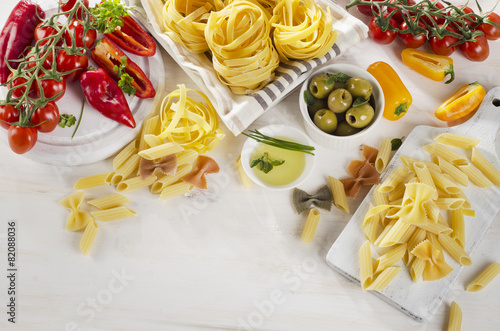 Healthy Italian food ingredients on a whiete wooden background. photo