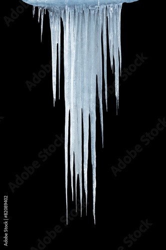 Ice icicles on a black background