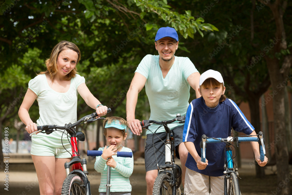 Parents and kids with bicycles