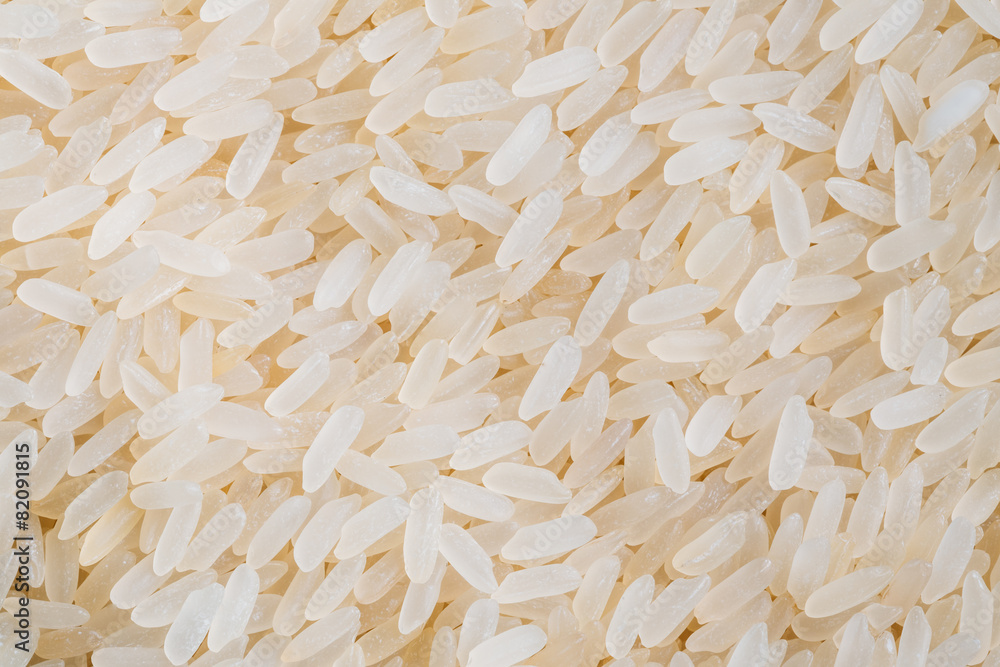 White Long Rice Background, Uncooked Raw Cereals White Long Rice Background, Uncooked Raw Cereals