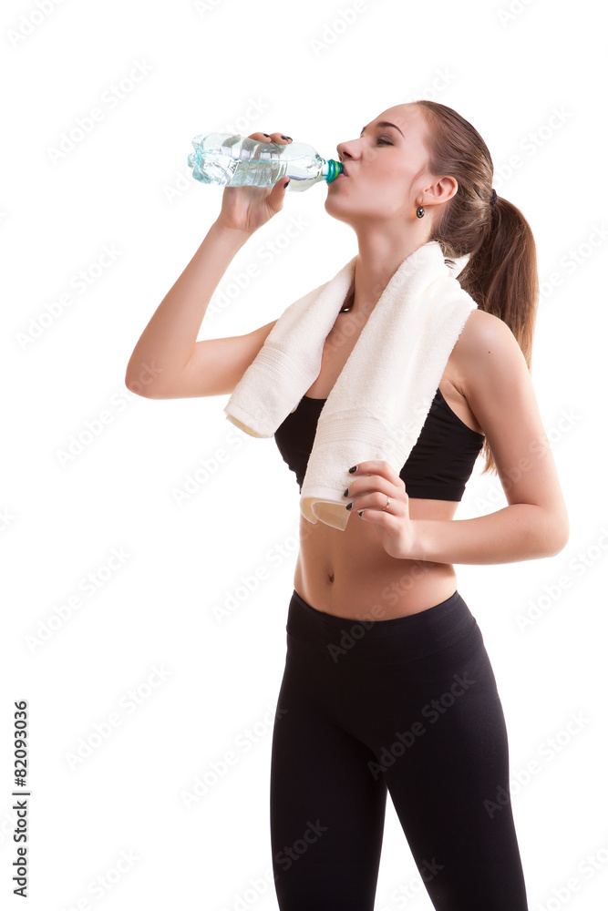 Woman after sport drinking water from bottle Woman after sport drinking water from bottle
