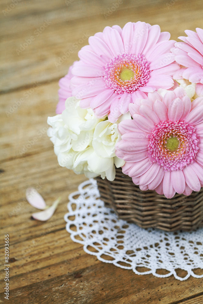 Bouquet of pink gerberas on wooden table