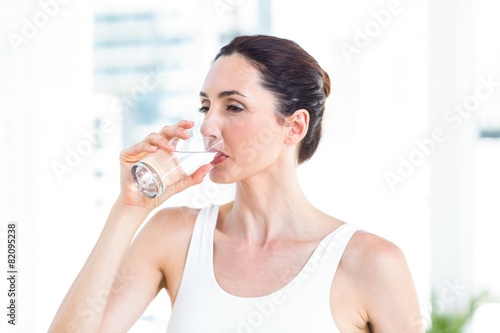 Brunette drinking water