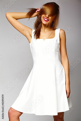 sexy stylish blond woman model in white dress