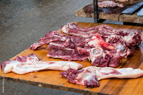 Raw pork  on wooden table at the market . photo