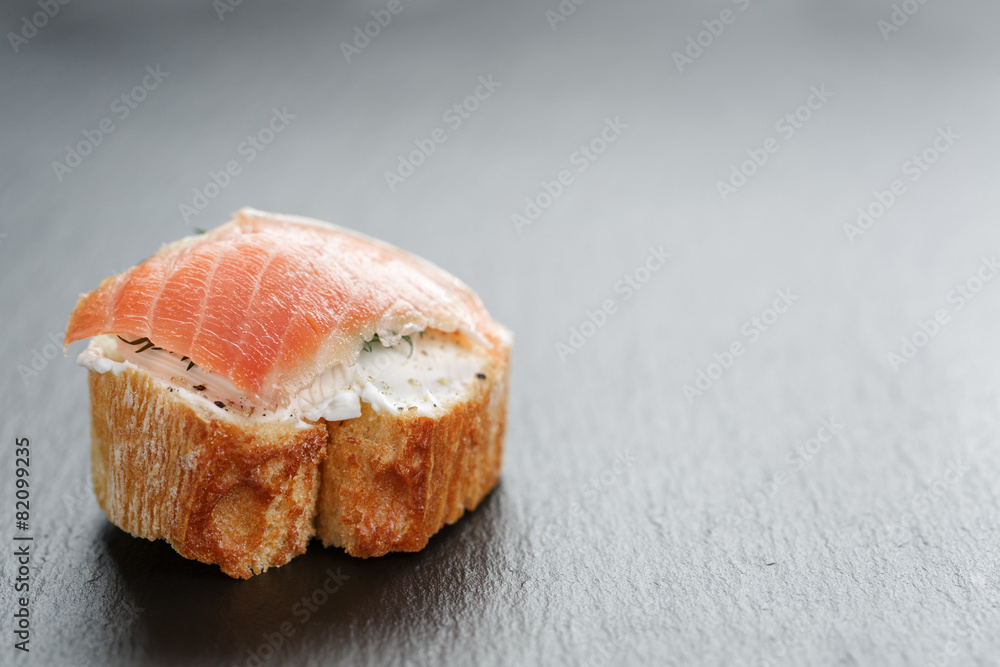 small sandwich with soft cheese and salmon