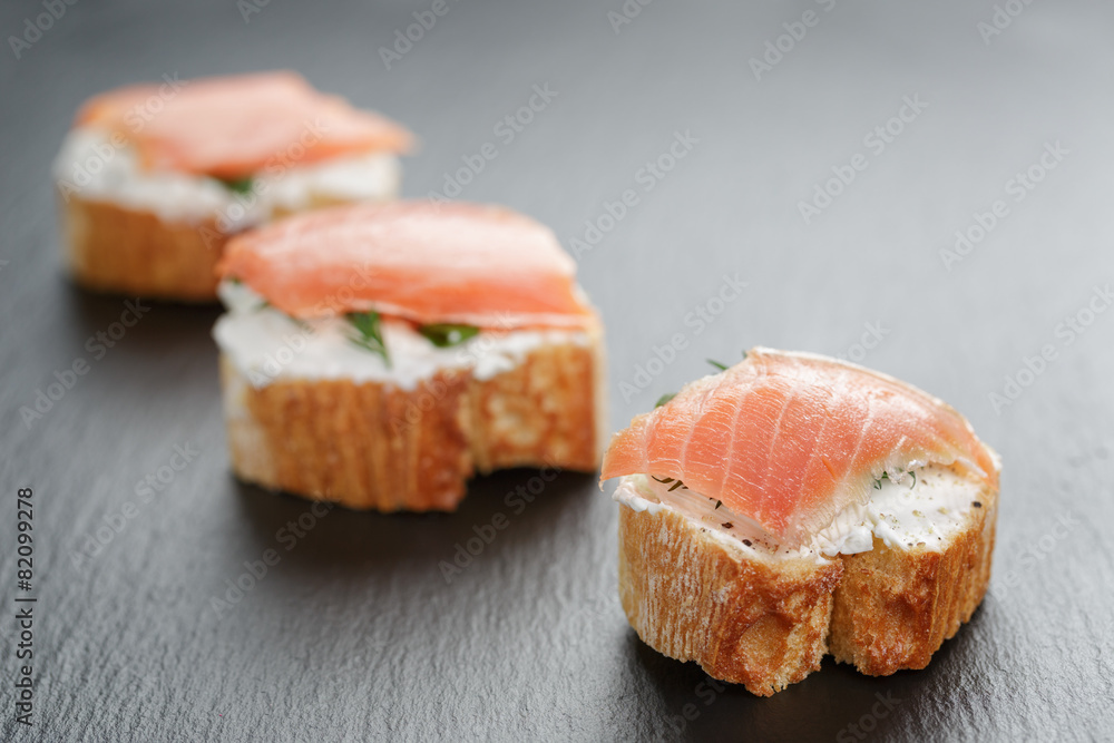 small sandwiches with soft cheese and salmon small sandwiches with soft cheese and salmon