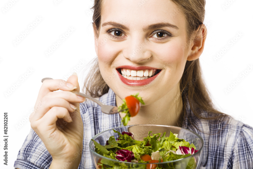 Beautiful, young woman eating vegetable salad Beautiful, young woman eating vegetable salad