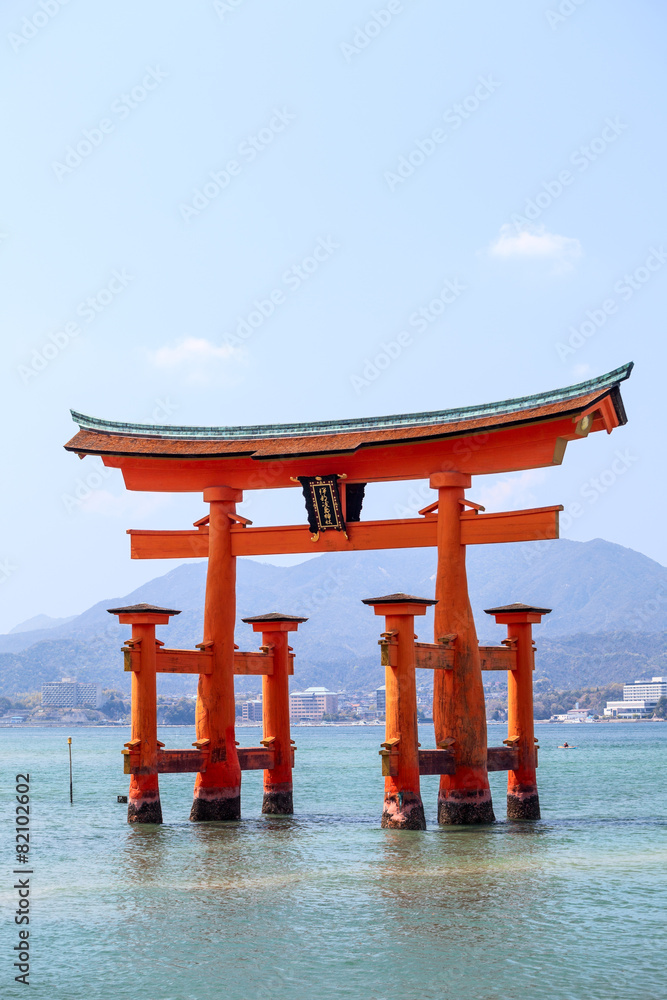 Red sacred torii Itsukushima Shrine in the sea at high tide, Jap Red sacred torii Itsukushima Shrine in the sea at high tide, Jap