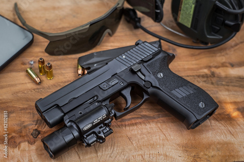 pistol on wood plate