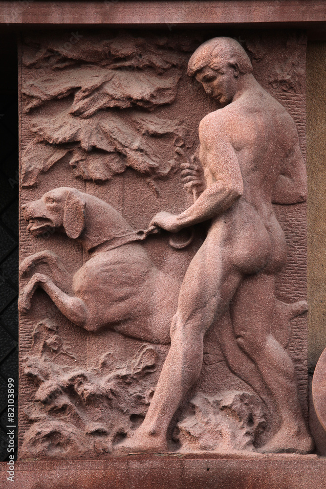 Naklejka premium Naked hunter with a dog.