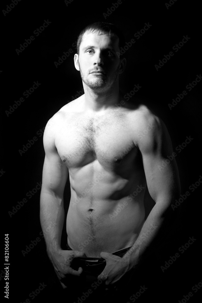 Portrait of shirtless handsome man in black and white