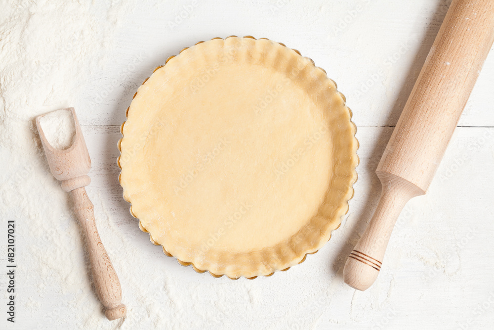 Tart pie preparation, dough with yeast and rolling pin on white - obrazy, fototapety, plakaty 