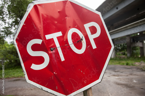 Stop sign with partly bent surface