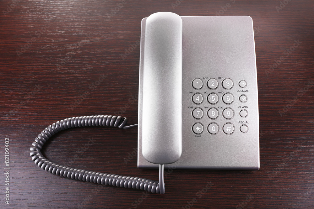 Telephone set on wooden background Telephone set on wooden background