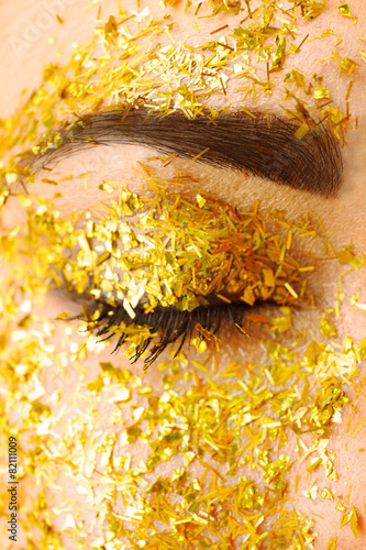 Female eye with fancy glitt...