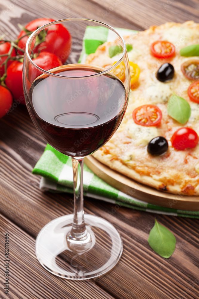 Glass of red wine and italian pizza Glass of red wine and italian pizza