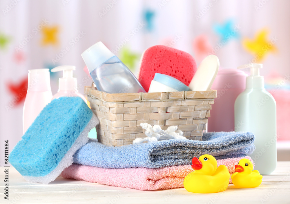 Baby accessories for bathing on table on light background Baby accessories for bathing on table on light background